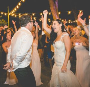 wedding couple dancing on night time dance floor