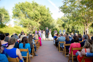Wedding ceremony on patio surrounded by oak trees at Paradise Ridge winery