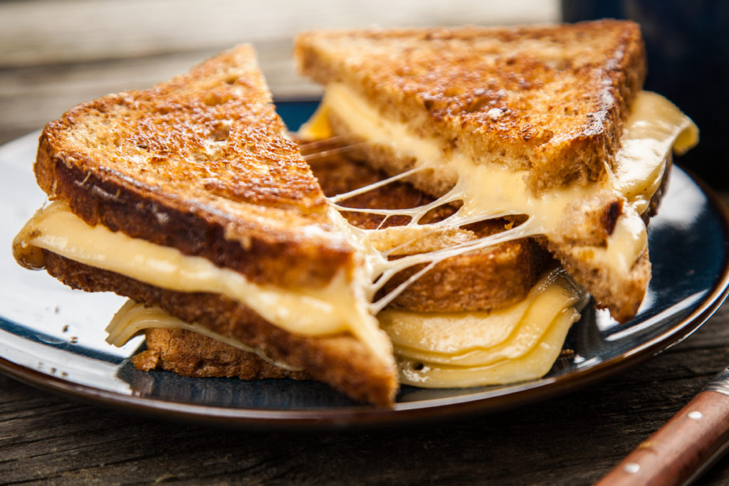 One of the cheapest wedding bar ideas is a grilled cheese bar.