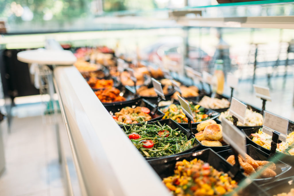 A salad bar is commonplace in wedding catering.