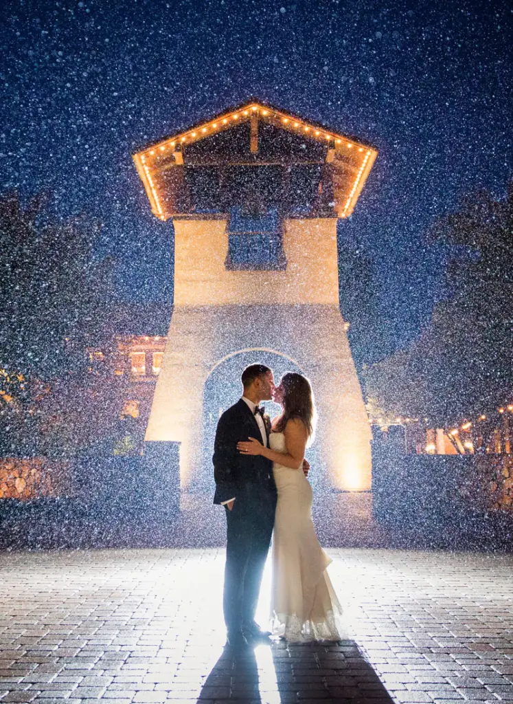wedding couple kissing in misty vignette